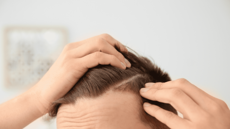 man checking his hair in detail